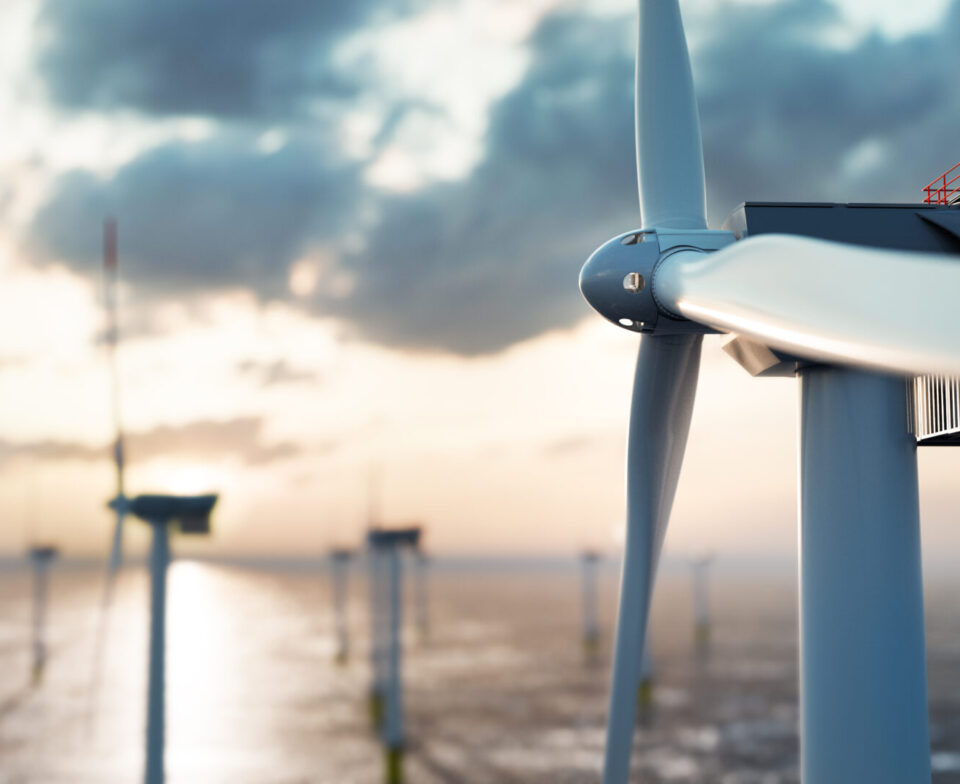 Offshore wind power and energy farm with many wind turbines on the ocean. Sustainable electricity production